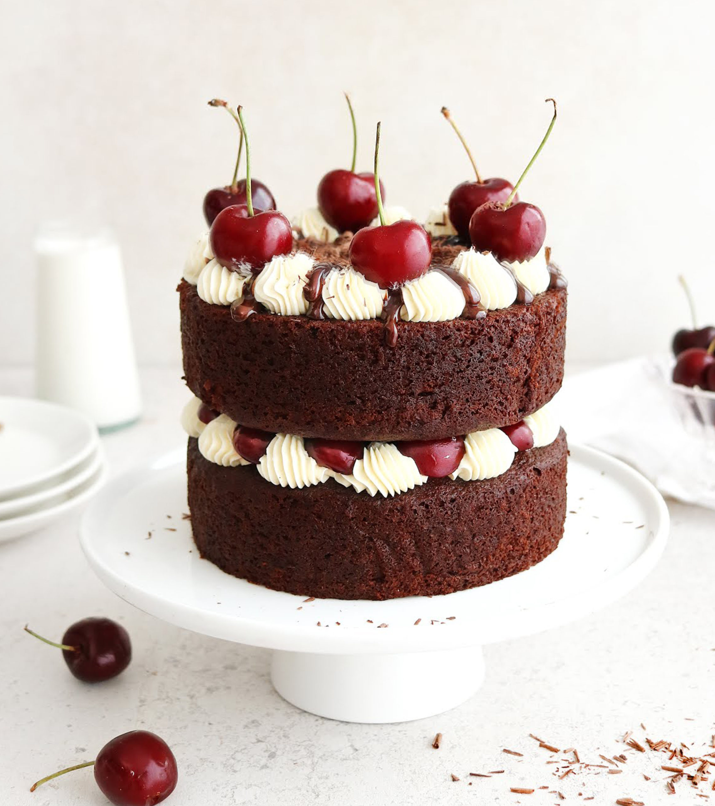 New Vegan Vanilla Black Forest cake with donuts and outlets chocolate chip cookies on the top 8” dairy free, egg free.